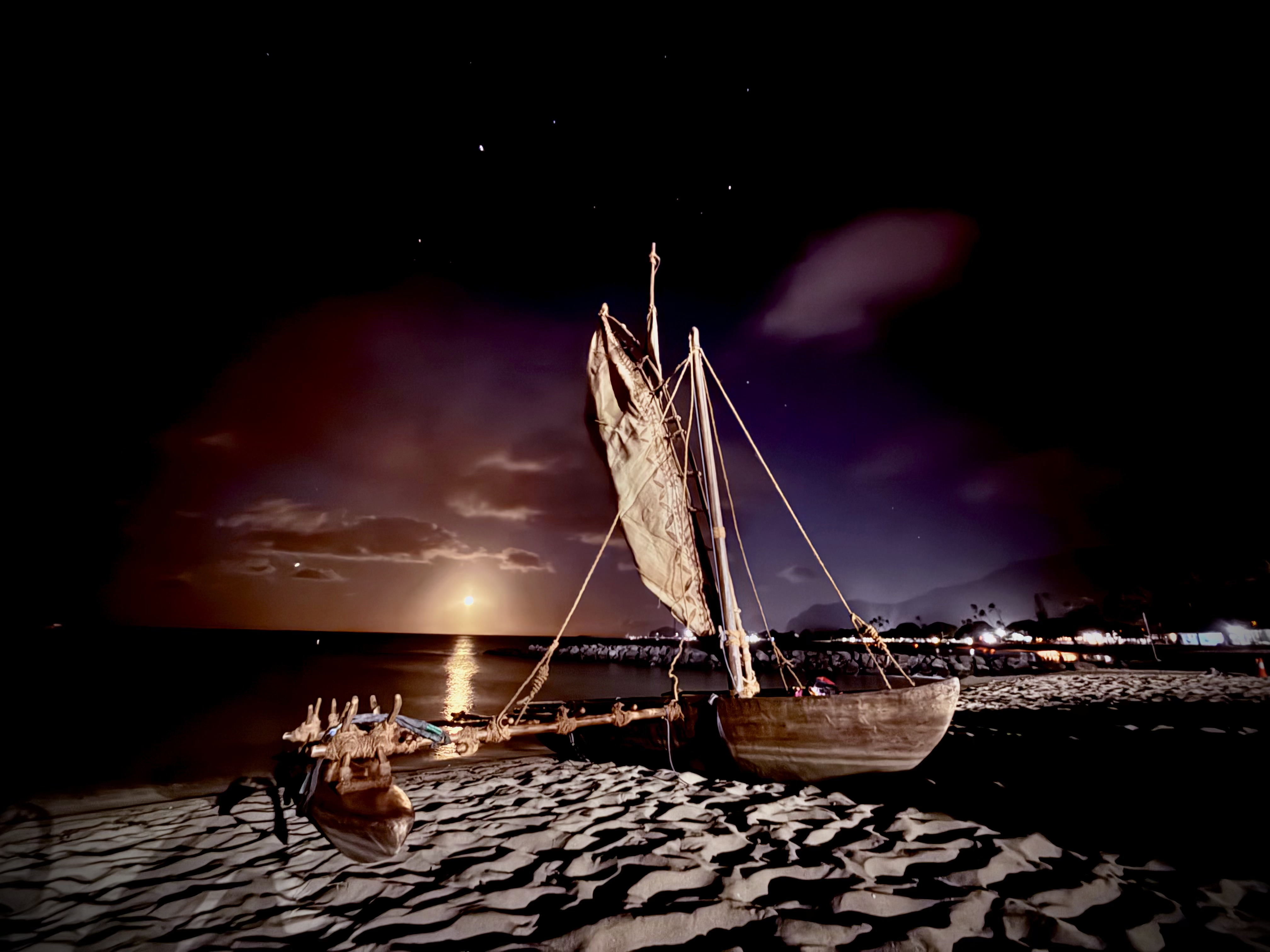 Multiple canoes on beach