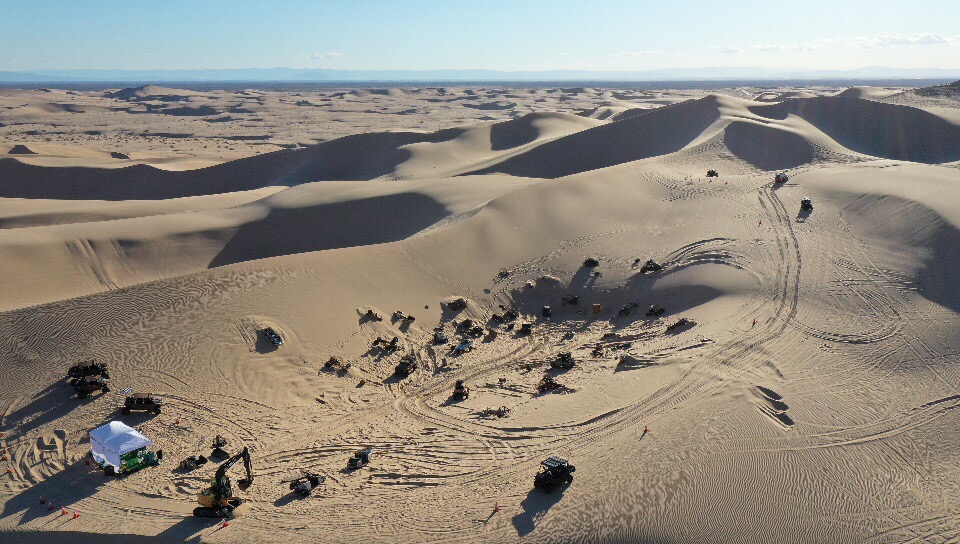 Aerial view of the dune buggy graveyard sequence in the Glamis Dunes